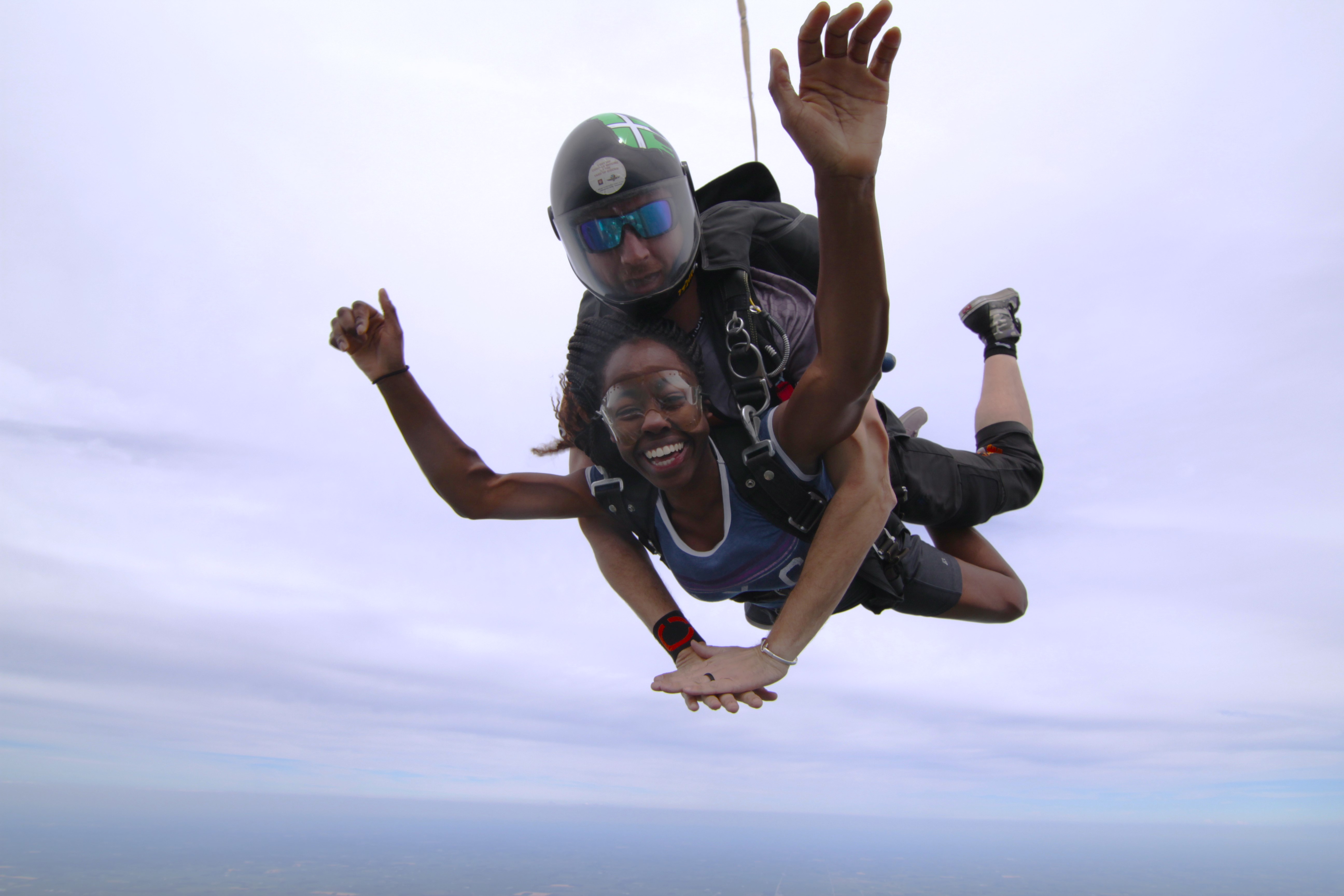 The author smiling while diving in mid air